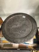 AN ISLAMIC PEWTER ALLOY DISH WITH AN EQUESTRIAN BOWMAN HUNTING DEER
