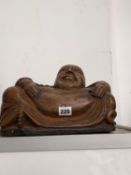 A CHINESE CARVED WOODEN FIGURE OF BUDAI