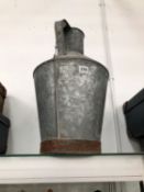 A GALVANISED METAL TWO HANDLED FLASK AND COVER.