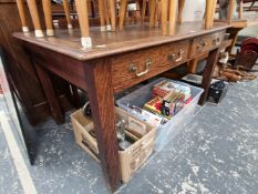 A VINTAGE OAK TWO DRAWER WRITING TABLE.