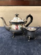 A HALLMARKED SILVER TEA POT AND SIMILAR CREAMER. 376 gms.