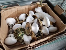 A COLLECTION OF WHITE CERAMIC DOOR KNOBS