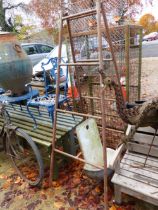 A FOLDING METAL TRESTLE STAND AND A FRENCH ENAMEL WALL BASIN.