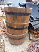 THREE MATCHING COOPERED BARREL FORM PLANTERS.