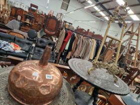 A BRASS DISPLAY EASEL AND A COPPER FUNNEL.