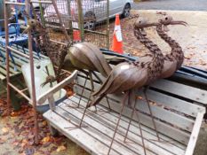 FOUR METAL CRANE GARDEN SCULPTURES.