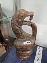 AN AFRICAN SOAPSTONE CARVING OF A COILED SNAKE