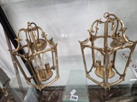 A PAIR OF BRASS THREE LIGHT SOCKET LANTERNS