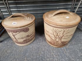 TWO OATMEAL POTTERY BREAD BINS AND COVERS WITH DARK BROWN LANDSCAPED SIDES