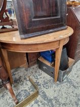 A 19th CENTURY PINE DEMI LUNE SIDE TABLE.