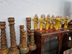 A QUANTITY OF CARVED WOOD CANDLESTICKS AND EGG TIMER FIGURES.