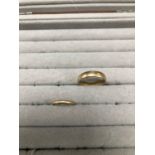 TWO 9ct HALLMARKED GOLD WEDDING BAND RINGS. FINGER SIZES V 1/2 AND L. GROSS WEIGHT 5.99grms.