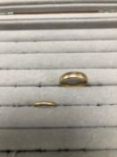 TWO 9ct HALLMARKED GOLD WEDDING BAND RINGS. FINGER SIZES V 1/2 AND L. GROSS WEIGHT 5.99grms.