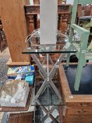 A PAIR OF GLASS TOPPED TABLES.