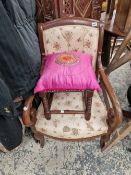 A CONTINENTAL MAHOGANY ARM CHAIR AND A FOOT STOOL.