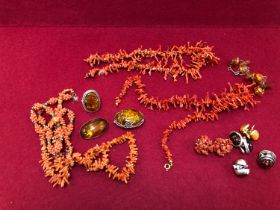 A QUANTITY OF AMBER,CORAL, RESIN AND OTHER JEWELLERY SOME PIECES SET IN SILVER.