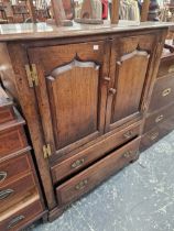 A BESPOKE OAK TV CABINET.