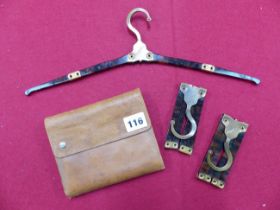 A SET OF FORTNUM AND MASON TRAVELLING CLOTHES HANGERS IN LEATHER FOLD OVER CASE.