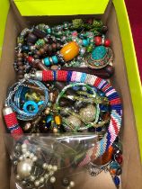 A COLLECTION OF ECLECTIC COSTUME JEWELLERY TO INCLUDE HAND BEADED NECKLACES, GLASS BEADS, EASTERN