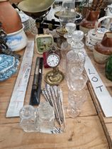 A SILVER CASED POCKET WATCH ON A BRASS STAND. BUTTON HOOKS, AN OIL LAMP, KITCHEN SCALES AND GLASS