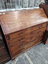 A GEORGE III MAHOGANY BUREAU.