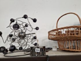 A CHANDELIER WITH THE LIGHT SOCKETS ARRANGED ON SCROLLING WIRES TOGETHER WITH A BASKET FOR A WINE