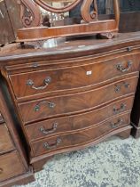 A REGENCY STYLE SERPENTINE BACHELORS CHEST TOGETHER WITH AN EDWARDIAN CHEST.