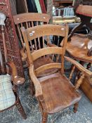 AN ANTIQUE BEECH AND ELM KITCHEN ARM CHAIR AND ONE OTHER.