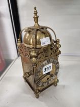 A SMALL ANTIQUE LANTERN CLOCK.