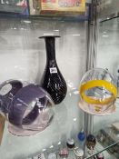 TWO ART GLASS EGGS TOGETHER WITH A STRIPED BLACK GLASS BOTTLE VASE