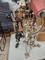 TWO WROUGHT IRON LAMP STANDS AND A BRASS FITTING.