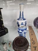 TWO CHINESE BLUE AND WHITE VASES, AND A WOODEN STAND