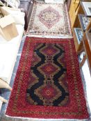 AN ORIENTAL TRIBAL BELOCH RUG TOGETHER WITH ANOTHER OF PERSIAN DESIGN (2)