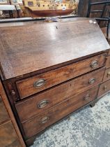 A GEORGE III OAK BUREAU.