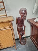 A LARGE CARVED AFRICAN FIGURE.