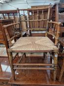 A VICTORIAN SPINDLE BACK MORRIS TYPE ARM CHAIR.