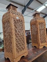 A PAIR OF PIERCED STEEL CANDLE LANTERNS.