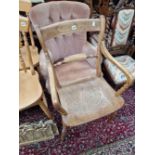A VICTORIAN OXFORD ARM CHAIR AND A BUTTON BACK CHAIR.