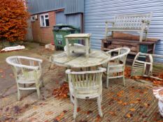 A COTSWOLD TEAK GARDEN TABLE WITH FIVE MATCHING CHAIRS, A SMALL COFFEE TABLE AND A SIMILAR BENCH.
