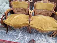 A PAIR OF CANE BACK FRENCH STYLE ARMCHAIRS.