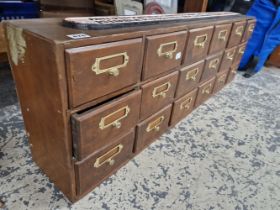 A NEST OF 18 FILE DRAWERS.