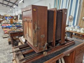 A LARGE AND IMPRESSIVE ANTIQUE MAHOGANY AND BRASS DOUBLE PLATE STUDIO CAMERA ON ADJUSTABLE RAIL