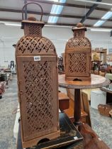 TWO PIERCED METAL CANDLE LANTERNS.