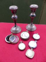 A PAIR OF HALLMARKED SILVER LOADED CANDLESTICKS TOGETHER WITH VARIOUS POCKET WATCHES.