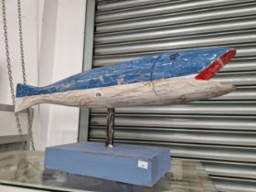 A PAINTED CARVED WOODEN FISH