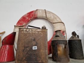 A LIFEBELT, AN OIL JUG, A PETROL CAN AND TWO OIL LANTERNS