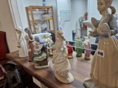 THREE LLADRO FIGURINES AND TWO OTHERS.