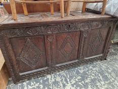 AN 18th C. CARVED OAK COFFER.