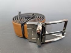 A ZEGNA REVERSIBLE BROWN AND BLACK LEATHER BELT WITH A GUN METAL BUCKLE