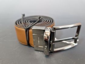 A ZEGNA REVERSIBLE BROWN AND BLACK LEATHER BELT WITH A GUN METAL BUCKLE